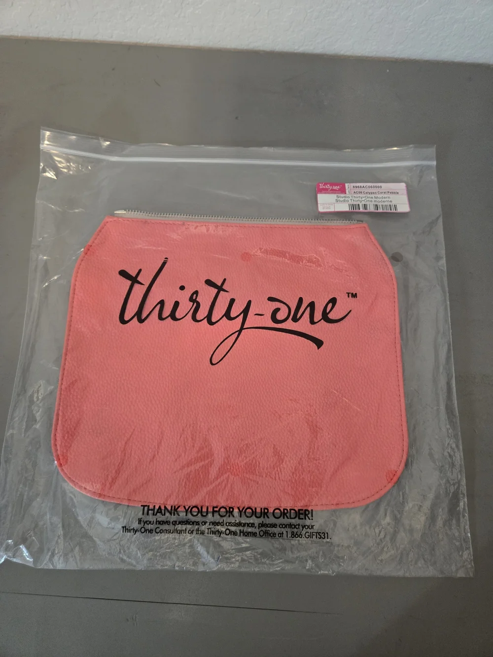 Thirty-One Black Crossbody Bag with Assorted Coral and Patterned Pouches